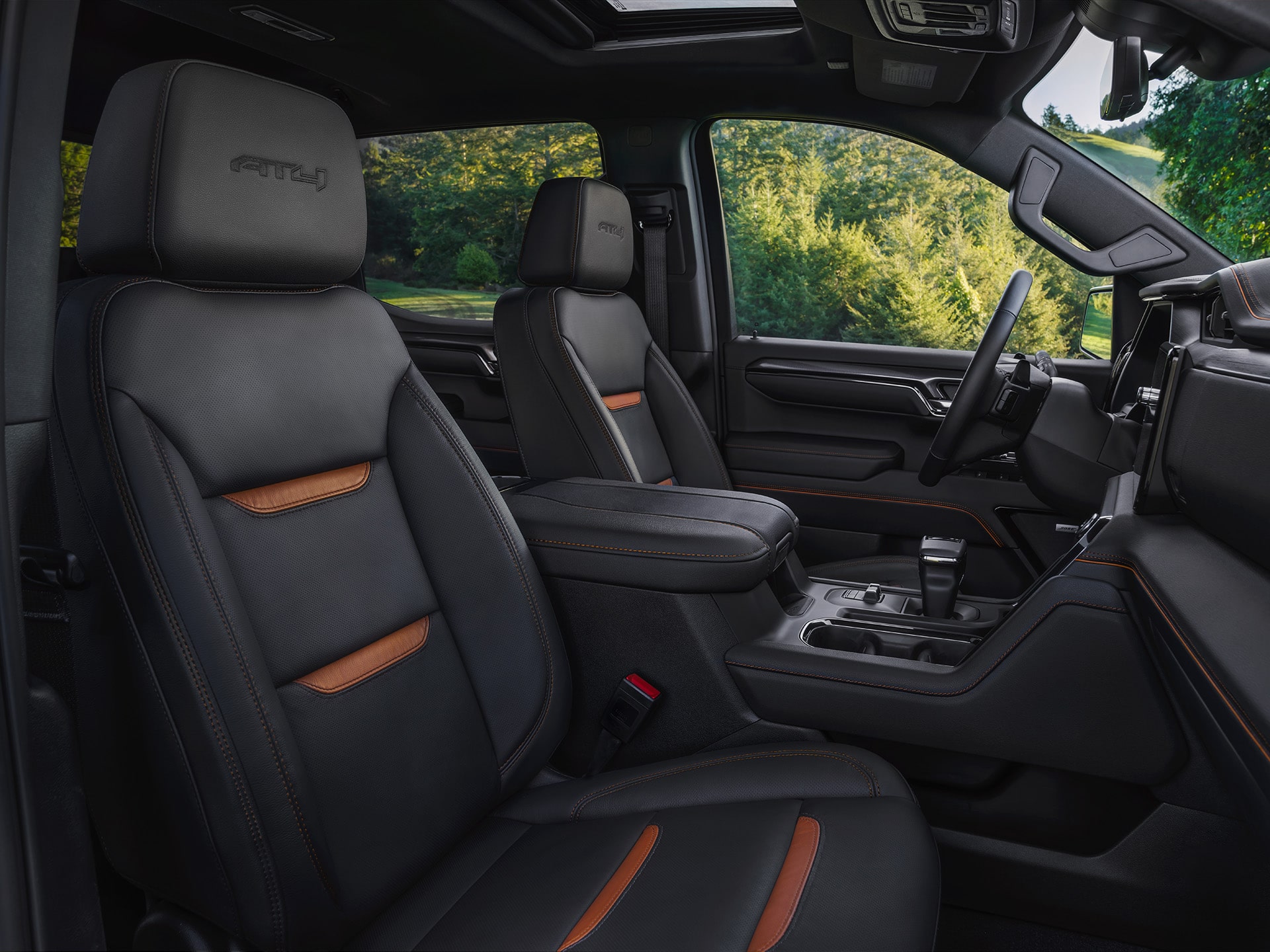Interior Front Row Seats in the 2026 GMC Sierra AT4 1500 Pickup Truck.