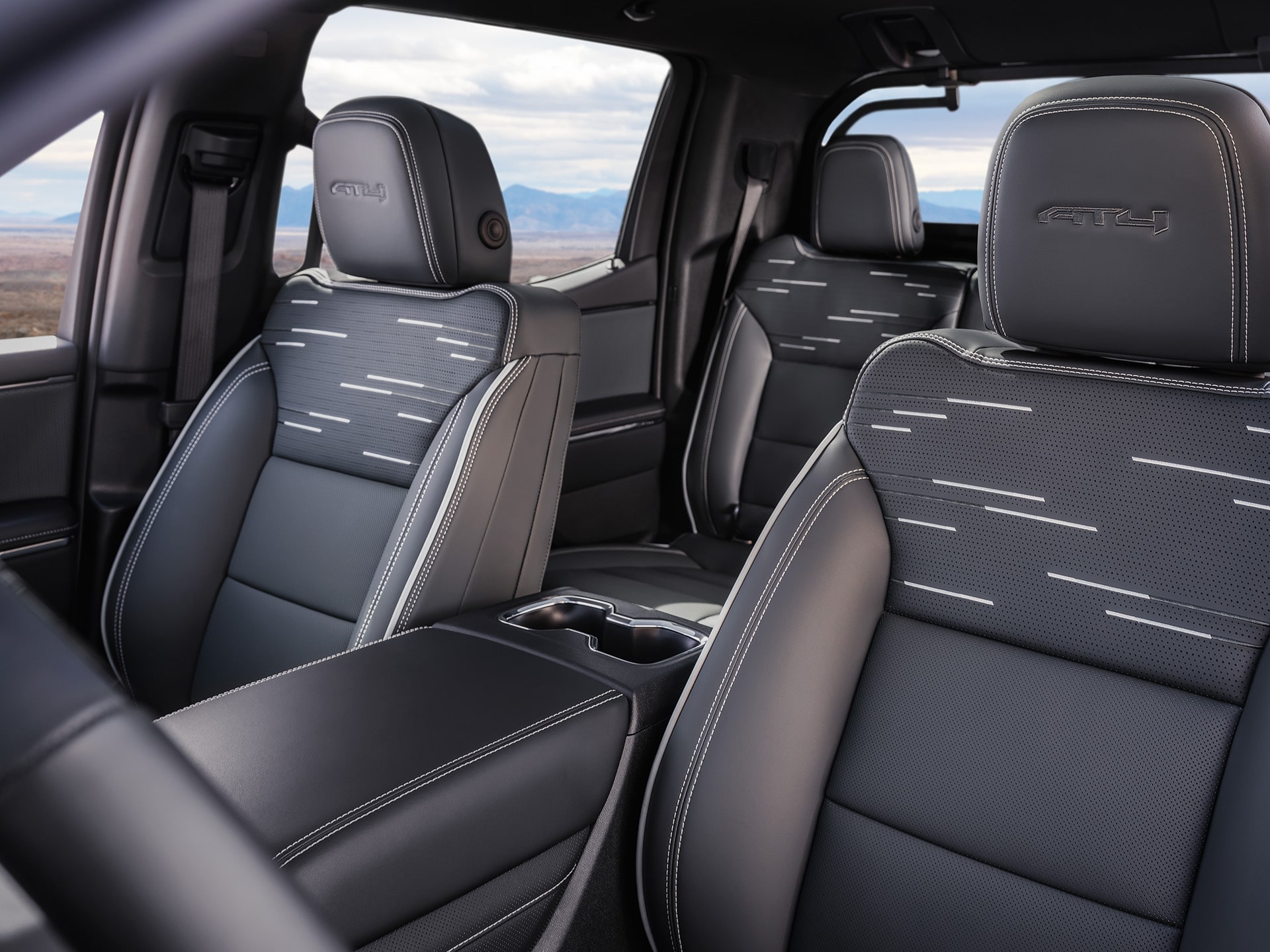 Interior View of the Front Row Seats in the 2026 GMC Sierra AT4 EV.