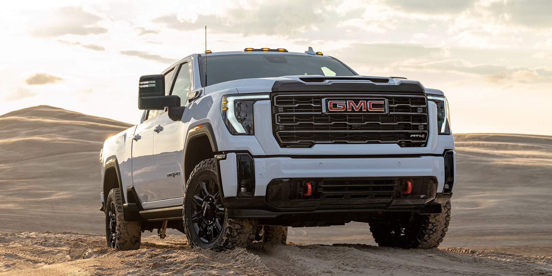 Front Three-Quarters View of the 2026 GMC Sierra HD AT4 Heavy Duty Truck.