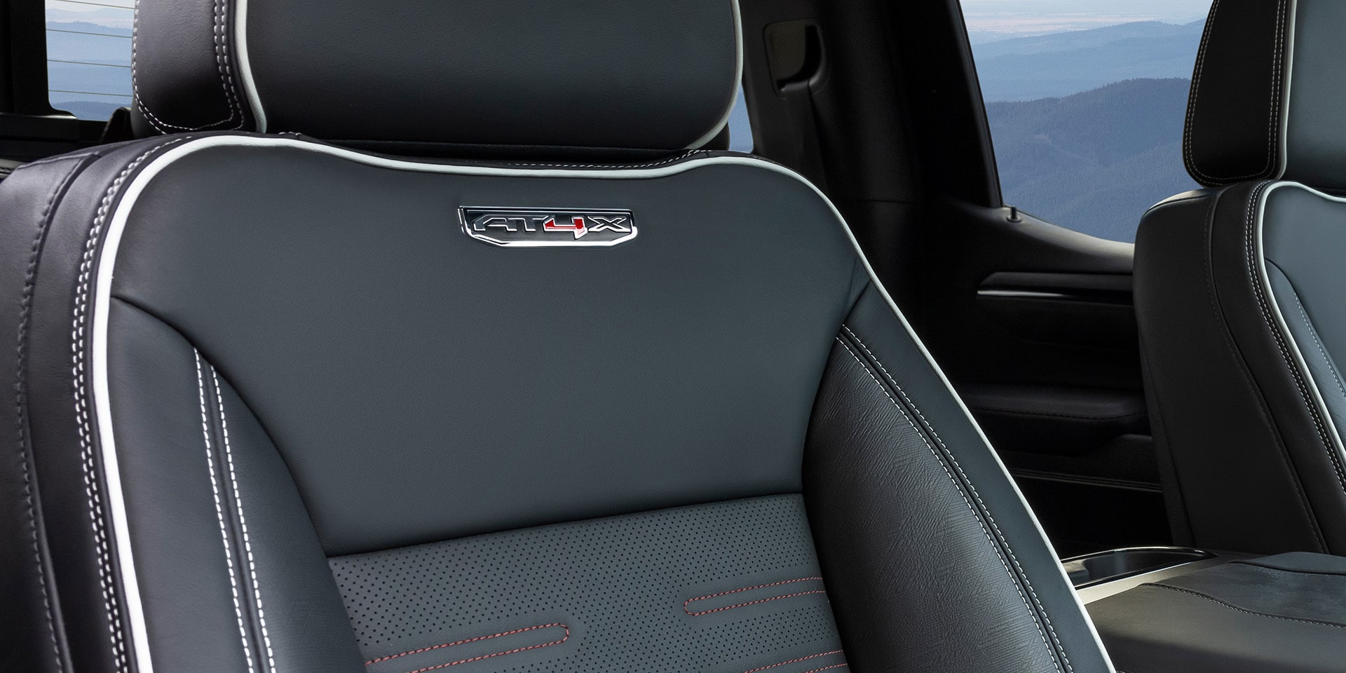 Interior View of the AT4 Badging on the seat of a 2026 GMC AT4 trim Truck.