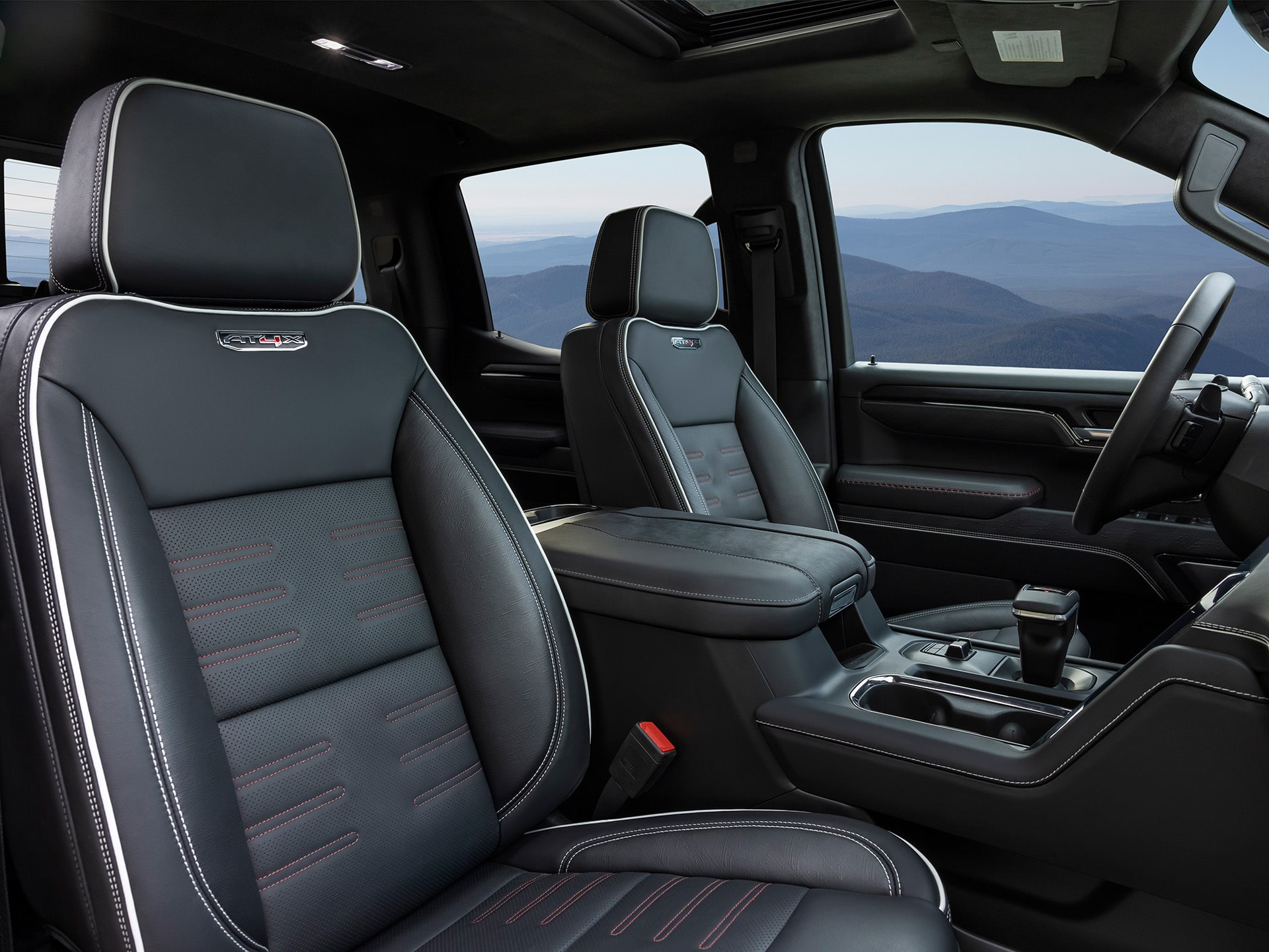 Interior View of the Front Row Seats in the 2026 GMC Sierra AT4X 1500 Pickup Truck.