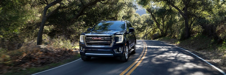 2021 GMC Yukon driving on the road.
