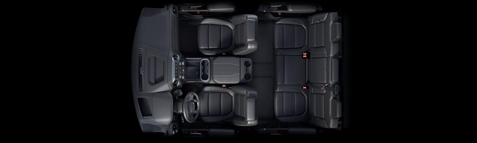 Bird's-eye view of the 2023 Sierra HD interior jet black front seating.