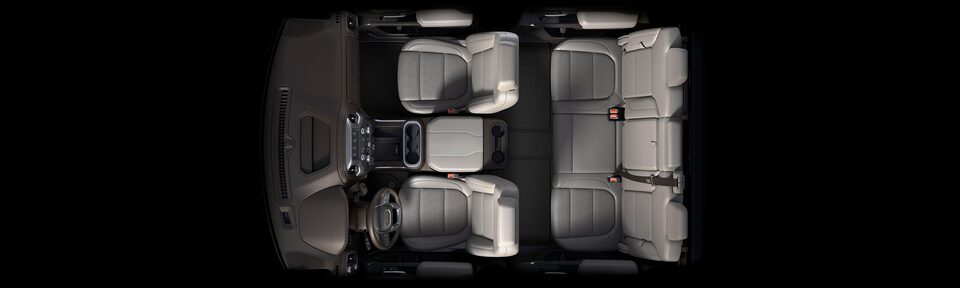 Bird's-eye view of the 2023 Sierra HD interior dark walnut/slate seats.