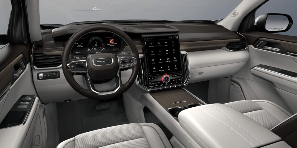 Habitacle côté conducteur du GMC Acadia Denali 2024 : gris diaphane et atmosphère très foncé.