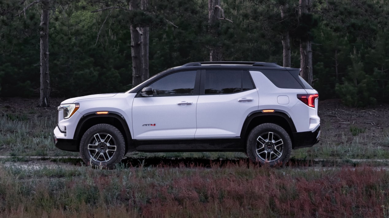 Side view of the 2025 GMC Terrain parked near trees.