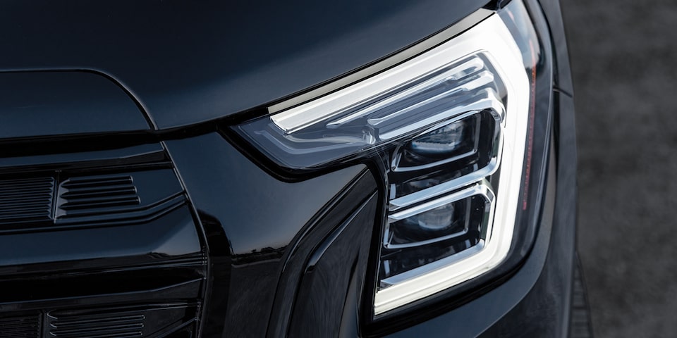 Close up view of the exterior headlamps of the 2025 GMC Terrain.