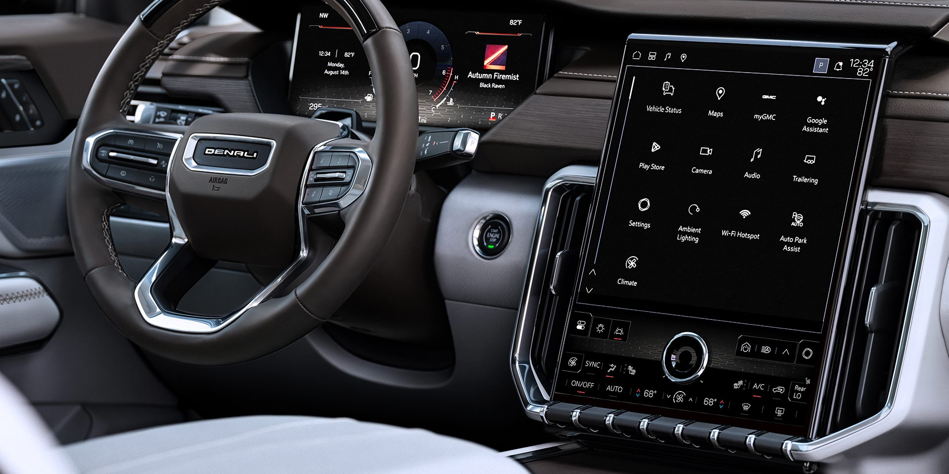 Intérieurs de la GMC Acadia 2027 avec un grand écran tactile vertical affichant diverses icônes d’applications et contrôles de climatisation.