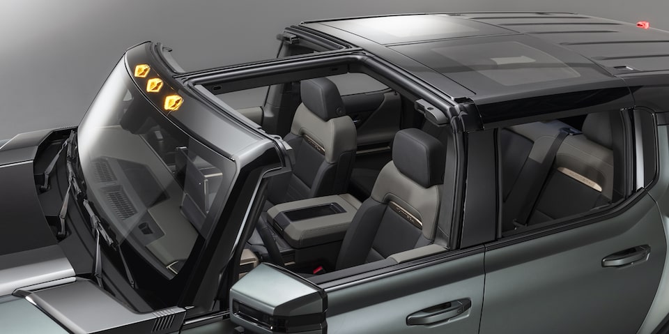 Partially open Infinity Roof of the GMC Hummer EV SUV.