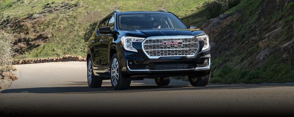 2024 Terrain Denali driving on the road.