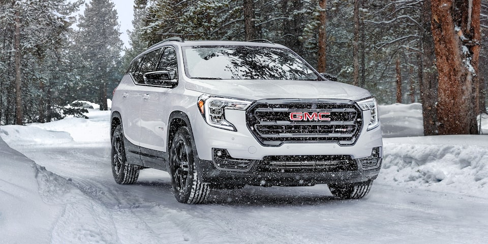 2024 GMC Terrain AT4 driving in the snow.