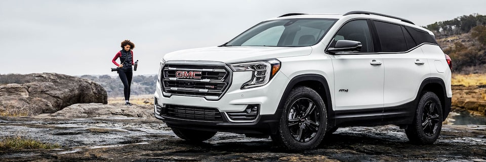 2024 GMC Terrain AT4 parked in rugged terrain.
