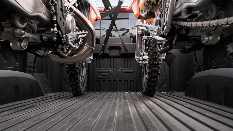 2022 GMC Sierra 1500 Denali steel cargo bed carrying cargo.