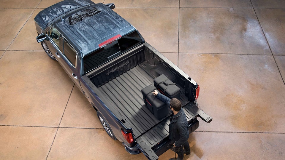 2022 GMC Sierra 1500 Denali driving off-road.