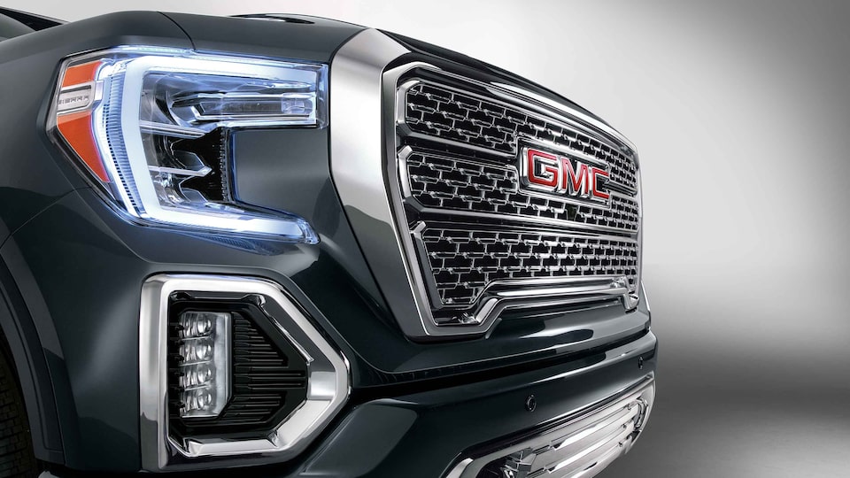 2022 GMC Sierra 1500 Denali exterior featuring the headlights and premium lighting.