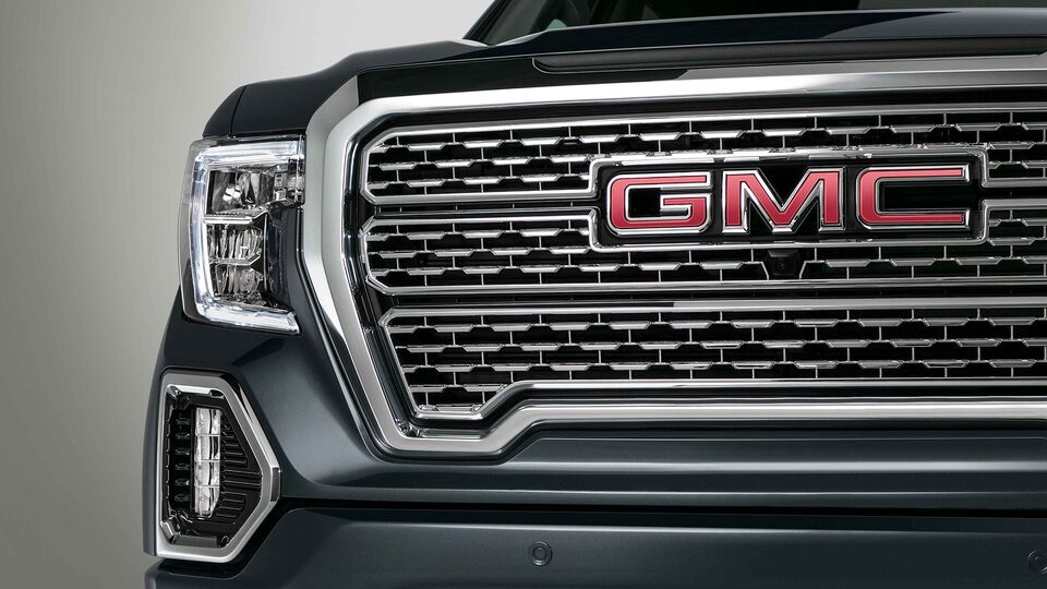 2022 GMC Sierra 1500 Denali exterior featuring the headlights and grille.