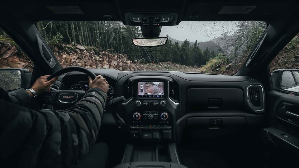 2022 GMC Sierra 1500 driving on the road.