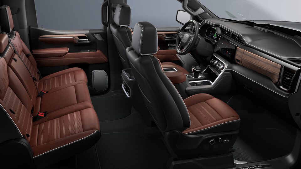 Side interior view of the 2022 GMC Sierra 1500 Denali Ultimate in Alpine Umber.