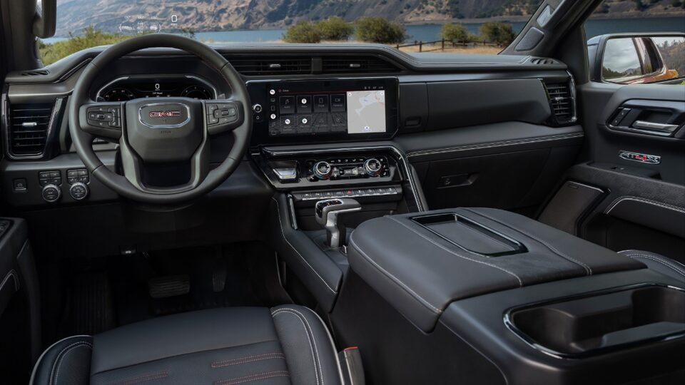 2022 GMC Sierra AT4X interior dashboard featuring the steering wheel and centre console.