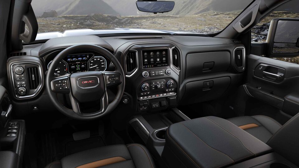 2023 Sierra HD AT4 athletic interior dashboard featuring the steering wheel.