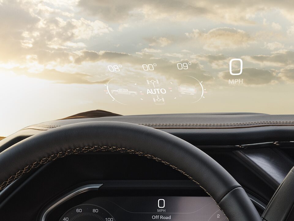 Reflected heads-up display of the 2024 GMC Sierra HD.