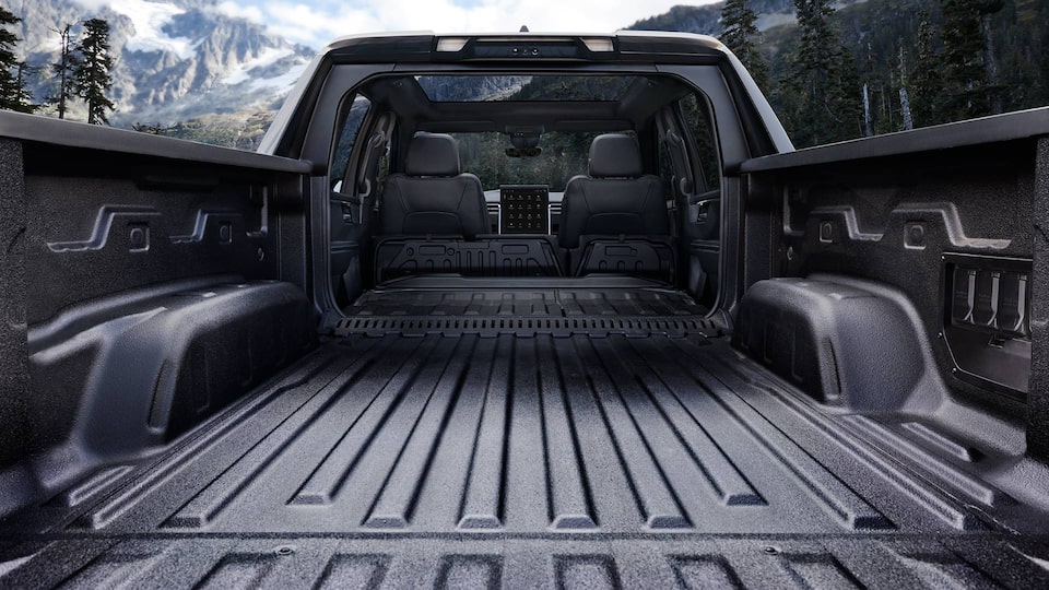 Close up view of the lowered trunk bed of the 2025 GMC Sierra EV Denali.