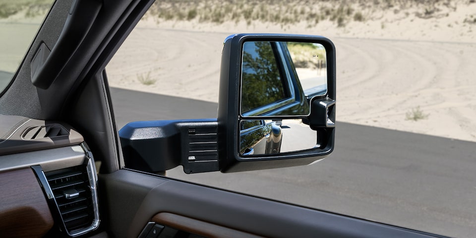 Close-up View of the Passenger Side Mirror on a 2025 GMC Sierra HD Pro/SLE/SLT Truck.