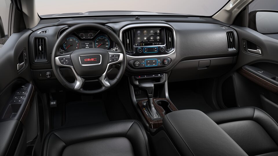 Intérieur avant du GMC Canyon 2022 avec sièges garnis de cuir noir jais.