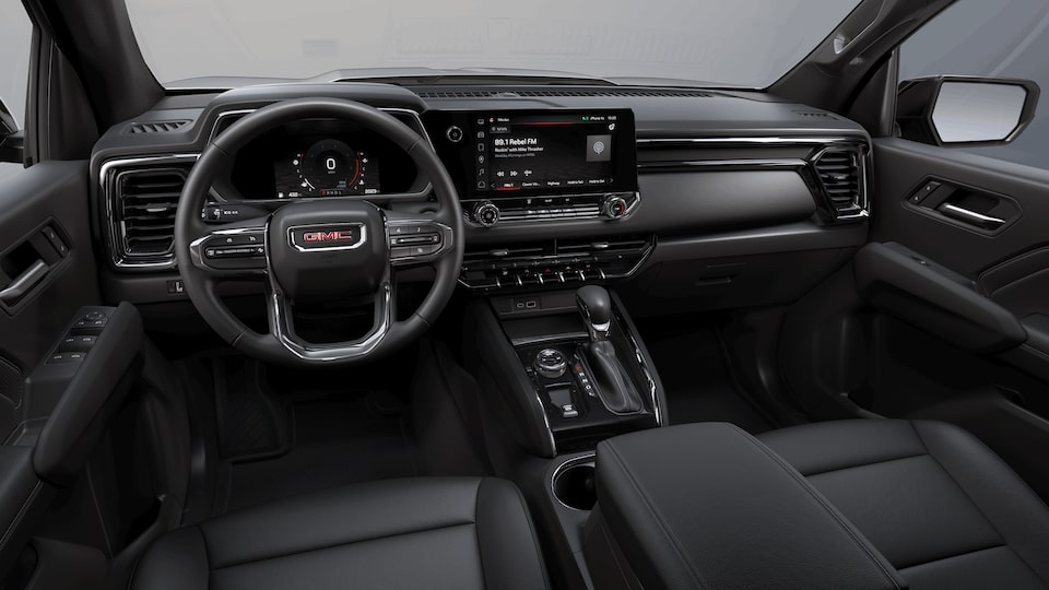 Front interior view of the 2022 GMC Canyon in Jet Black Leather-appointed front seats.