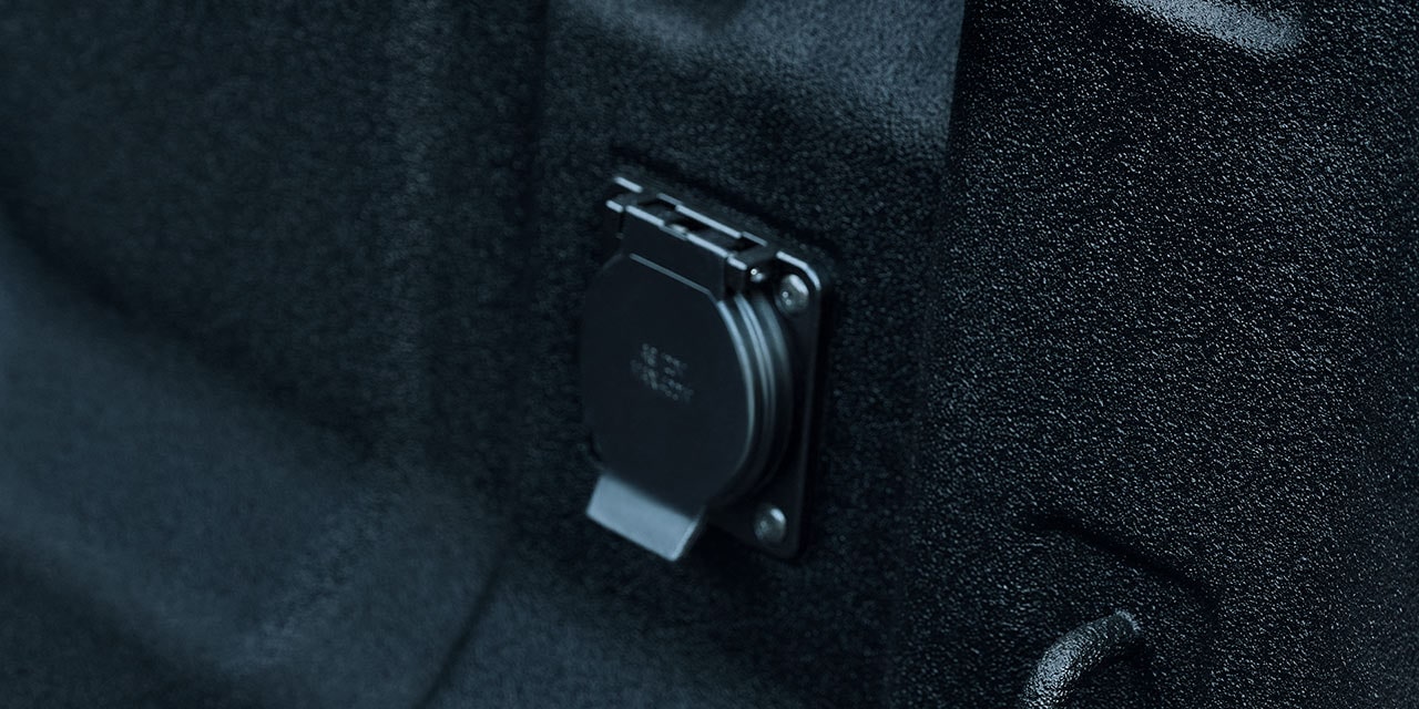 Close-up view of an outlet on the cargo bed of the 2026 GMC Canyon Elevation.