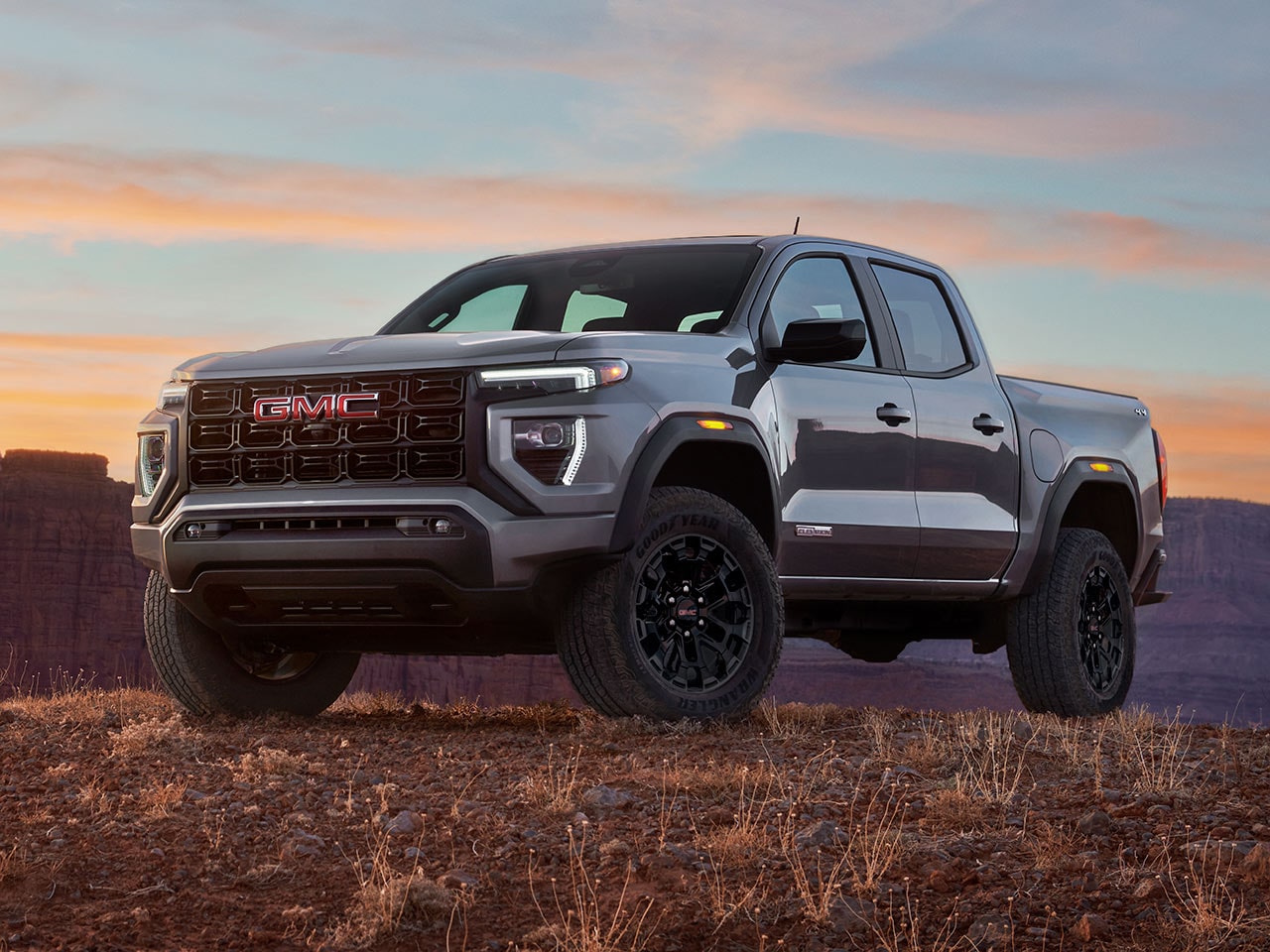 Side view of the 2026 GMC Canyon Elevation parked outdoors during sunset.