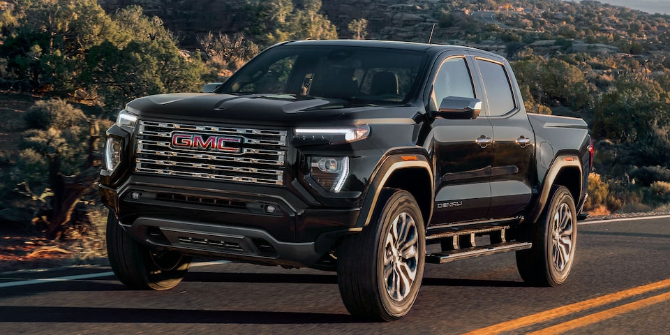 2024 Canyon Denali driving on the road.