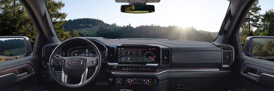 Rear passenger's perspective on the interiors of the 2024 GMC Sierra 1500 SLE.