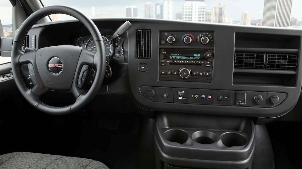 2023 GMC Savana Cargo dashboard featuring the steering wheel and controls.