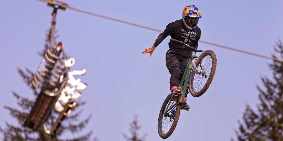 A person Mountain Biking at a Red Bull event.
