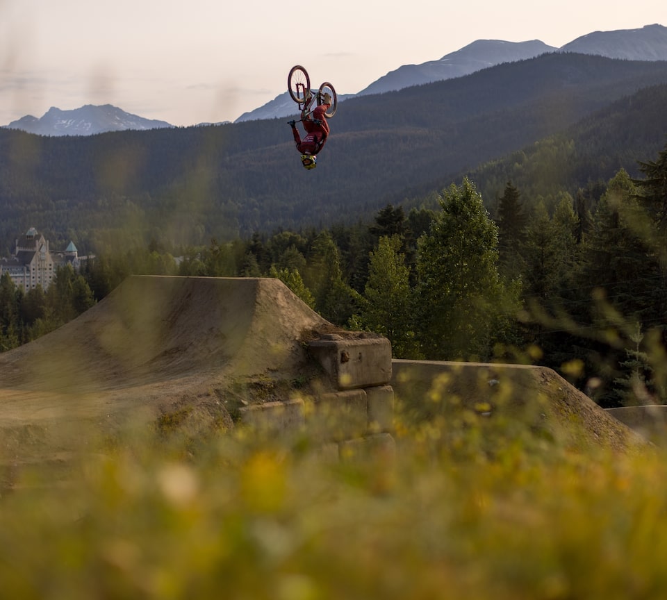 A biker performing a stunt in a Red Bull Joyride event.