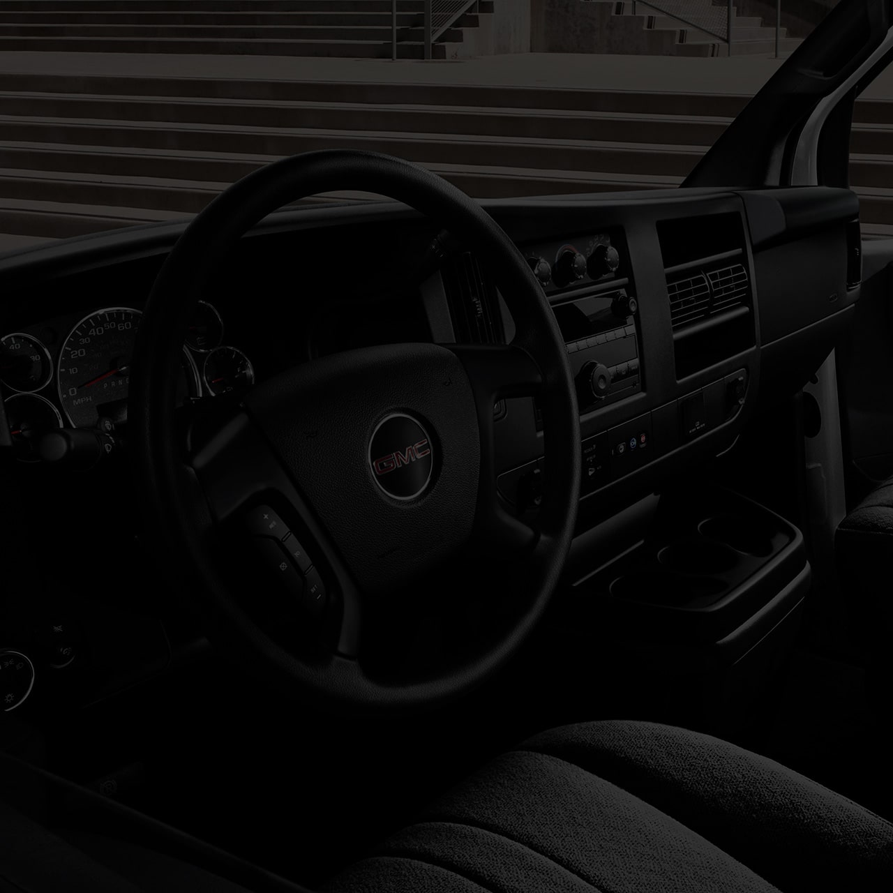 Interior View of the Steering Wheel of a 2026 GMC Savana Cargo Van.