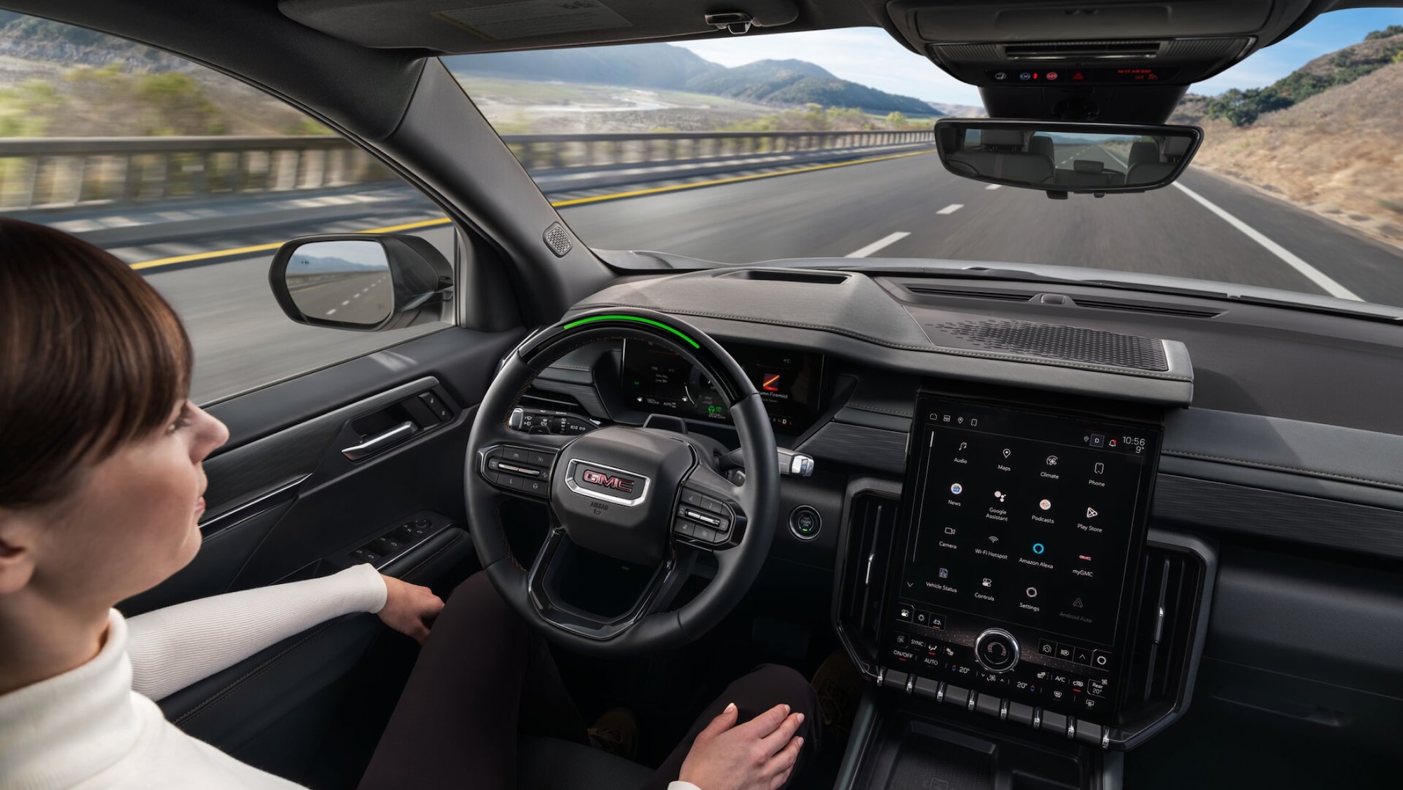 A person utilizing the Super Cruise feature inside an OnStar-subscribed GMC vehicle.