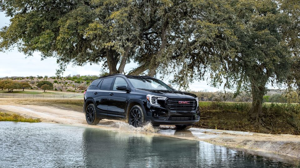 2022 Terrain SLE/SLT Elevation Trim driving on wet terrain.