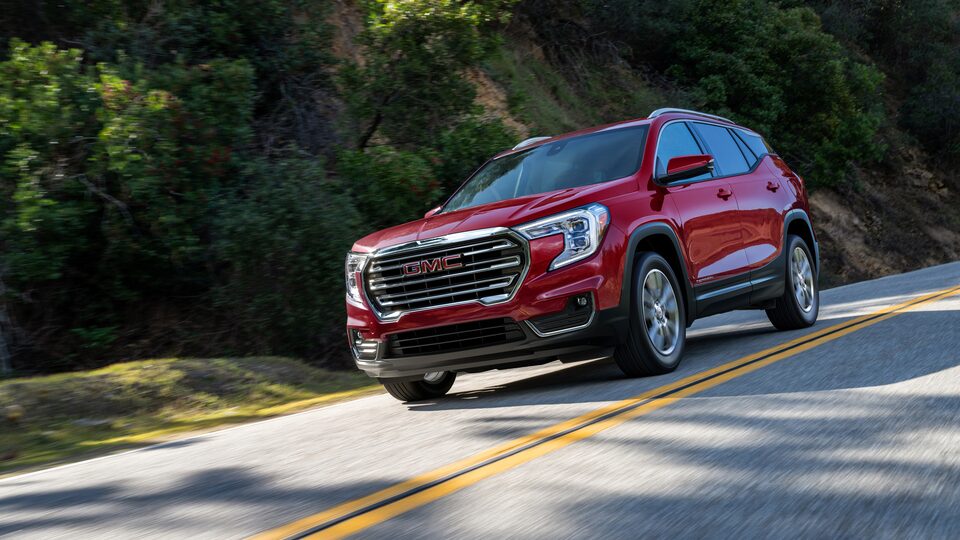 2022 Terrain SLE/SLT driving on the road.