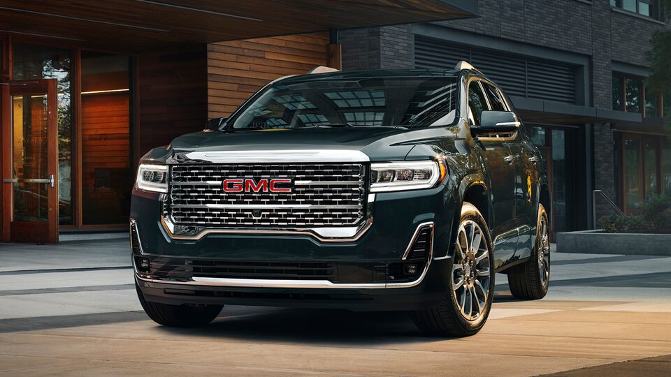 2023 Acadia Denali parked outside.