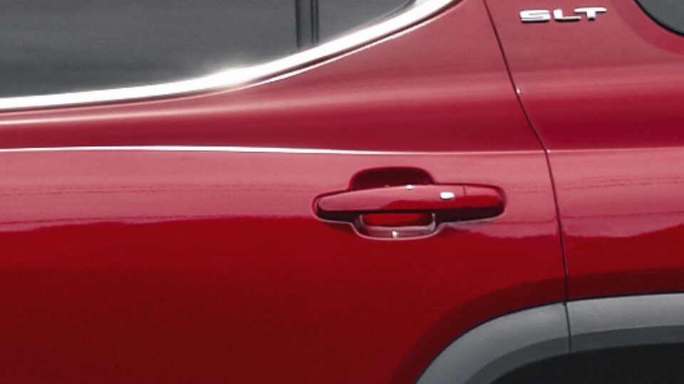 2023 GMC Acadia parked outside a home.