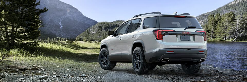 Rear side-view of the 2023 Acadia AT4 with black chrome accent.