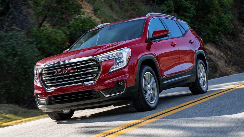 2023 Terrain SLE/SLT driving on the road.