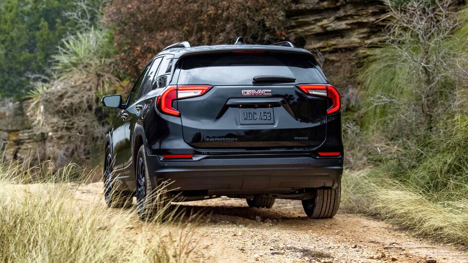 Back view of the 2023 Terrain SLE/SLT Elevation Trim driving off-road.