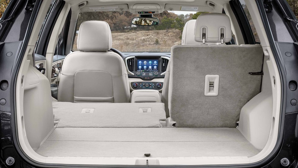 2023 GMC Terrain cargo space with seats folded, including front passenger seat.