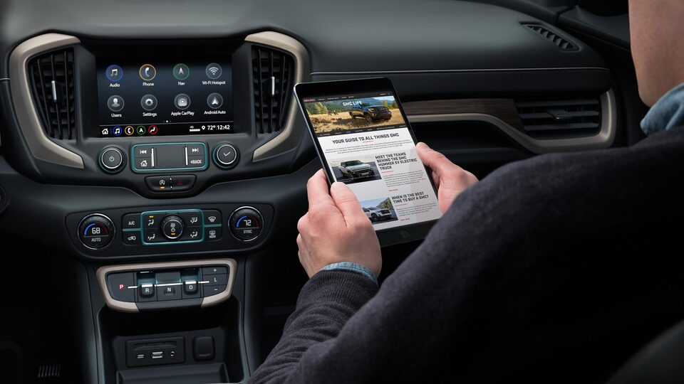 Person using the build-in Wi-Fi in the 2023 Terrain.