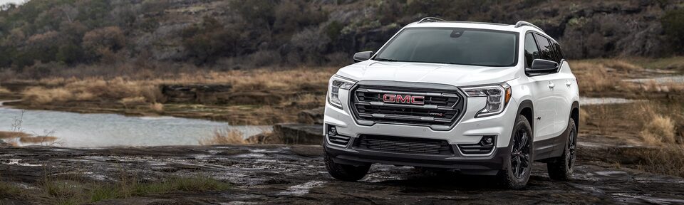 2023 GMC Terrain AT4 driving off-road.