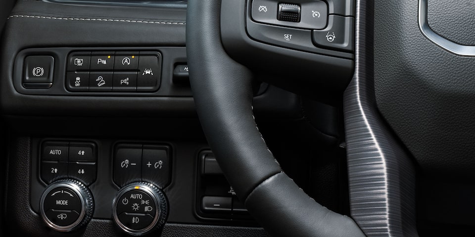 The Autotrac Two-Speed Transfer Case beside the steering wheel on the 2024 GMC Yukon AT4.