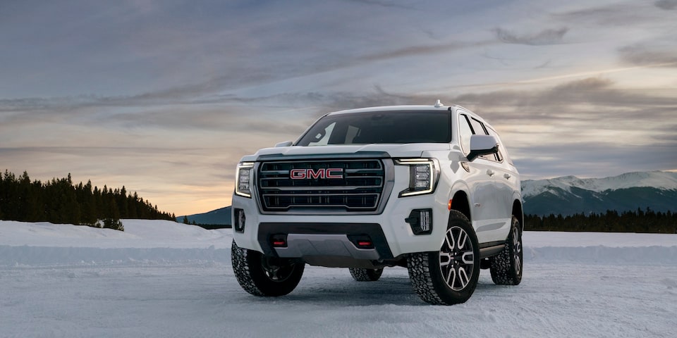 2024 GMC Yukon AT4 parked on a snowy environment.
